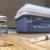 COVID-19 vaccine and a syringe. Photo: Mehmet Turgut Kirkgoz (@tkirkgoz)