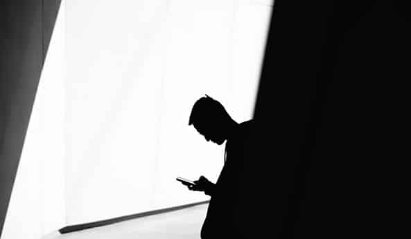 Young person with cell phone. Photo: Warren Wong (@wflwong)