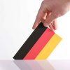 Hand holding German flag. Photo: Marco Verch Professional Photographer (CC BY 2.0)