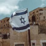 Israel’s trilemma. Israeli flag in Jerusalem. Photo: Taylor Brandon (@house_42)