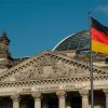 German elections: more continuity than change. German flag and the federal parliament in the background, Berlin. Photo: Herman (CC BY-SA 2.0)