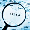 Libia en la estrategia del Estado Islámico: ¿qué implicaciones para el norte de África y el sur de Europa? Mapa de Libia aumentado con una lupa.