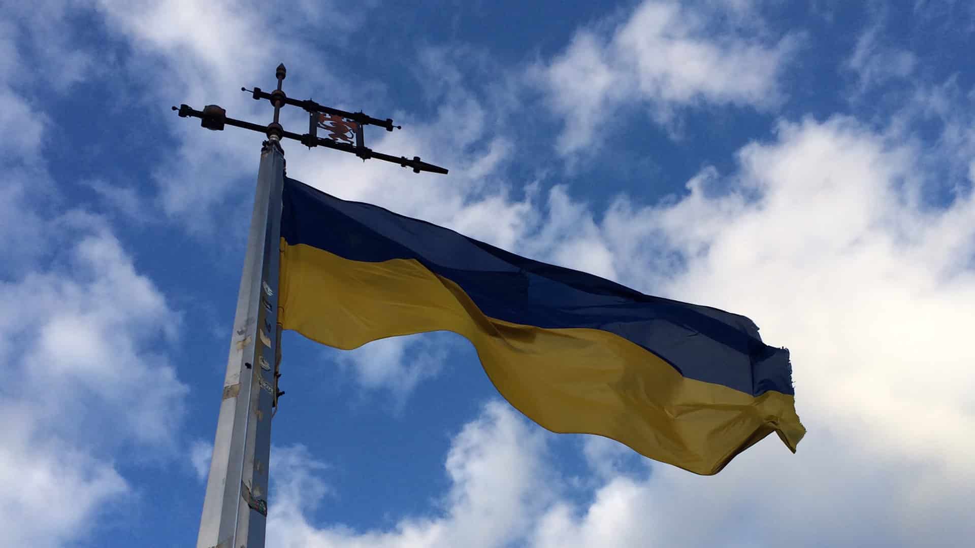Close-up of the Ukrainian flag flying on a flagpole atop the hill of the High Castle in Lviv.