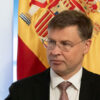 Foreground: Valdis Dombrovski, European Commission Executive Vice-President for an Economy that Works for People and Commissioner for Trade. Background: flags of Spain and the European Union