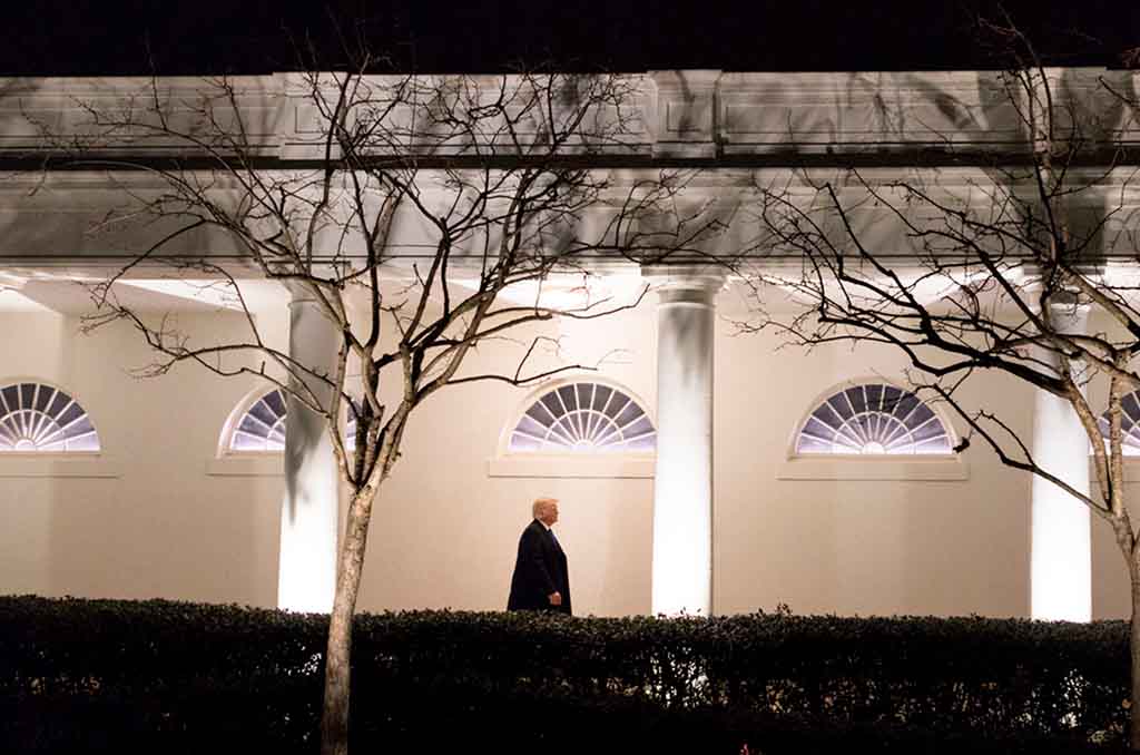 Trump, one year later. President Donald J. Trump walks down the West Colonnade of the White House (January, 2017). Photo: D. Myles Cullen / The White House (Public domain)