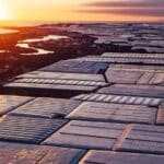 Spain prays for rain on the plain. Aerial panoramic of greenhouses in Almerimar (Spain) at the sunset