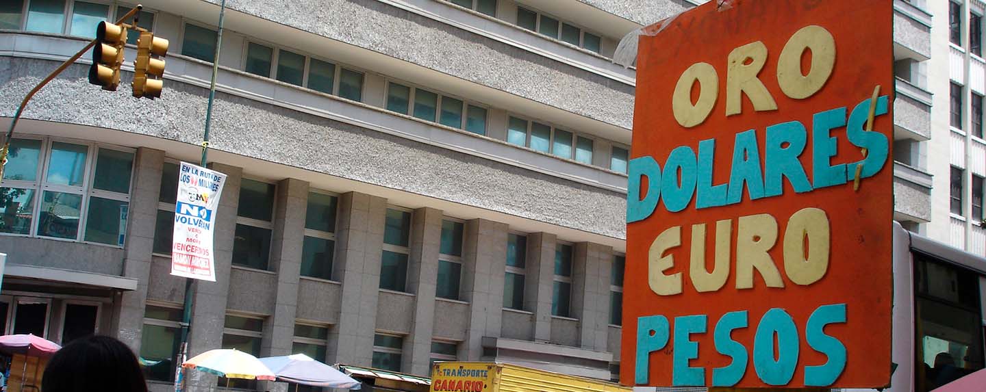 Advertising for gold, dollar, euro, and peso exchange on Veroes and Avenida Urdaneta in Caracas, Venezuela