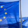 Three European Union flags fly in the financial district of La Défense in Paris, France. Team Europe