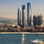 Aerial view of Etihad Towers and Emirates Palace Hotel in west Abu Dhabi, capital of the United Arab Emirates, one of the most influential countries of the Gulf Cooperation Council