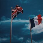 UK and French flags waving. Elections France UK