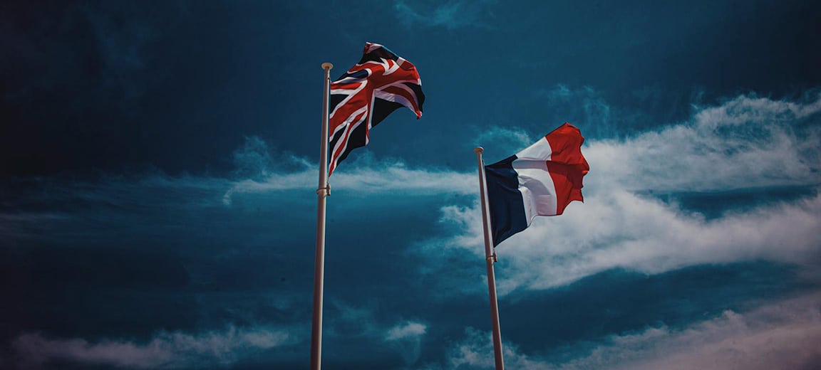 UK and French flags waving. Elections France UK