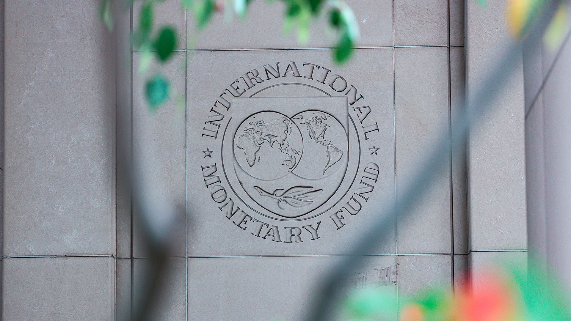 Close-up of the International Monetary Fund (IMF) logo engraved on the façade of its headquarters building in Washington (USA). IMF