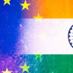 Superimposition of the blue flag with yellow stars of the European Union and the tricolour flag of India, with orange, white with the blue Ashoka Chakra symbol, and green stripes. India