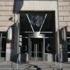 Main entrance to the United States Agency for International Development (USAID) building in Washington, D.C., with the sign covered by a black tarpaulin following its closure.
