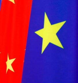 A row of European Union flags (blue with yellow stars) and Chinese flags (red with yellow stars) waving side by side during the 2020 EU–China summit.