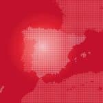 Vector illustration of the map of Spain transformed into dots as part of Europe and the Iberian Peninsula, with the north coast of Africa, on a dark red background.